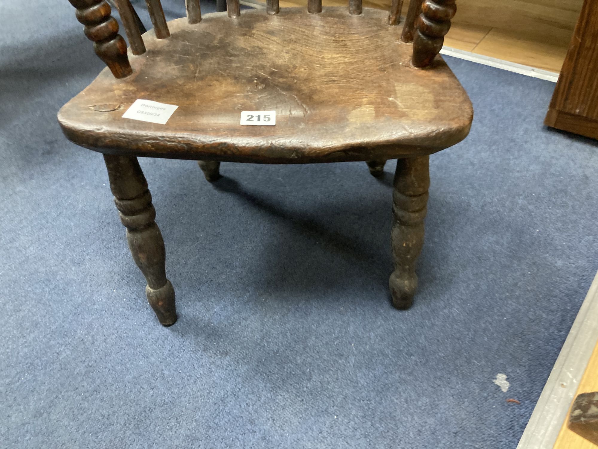 A 19th century elm and fruitwood childs Windsor elbow chair, width 40cm depth 30cm height 64cm